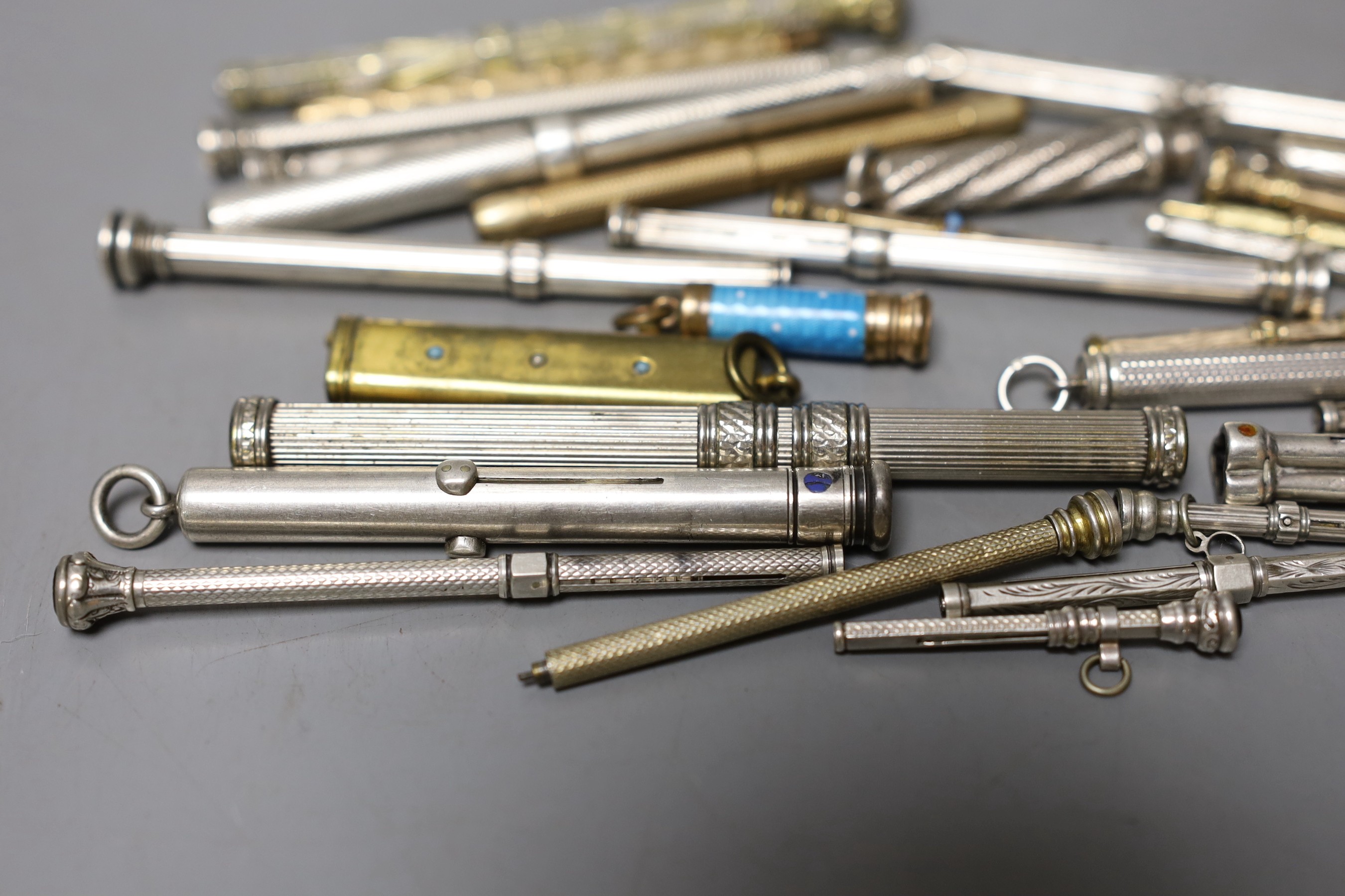 A collection of assorted white and base metal propelling pencils, etc.